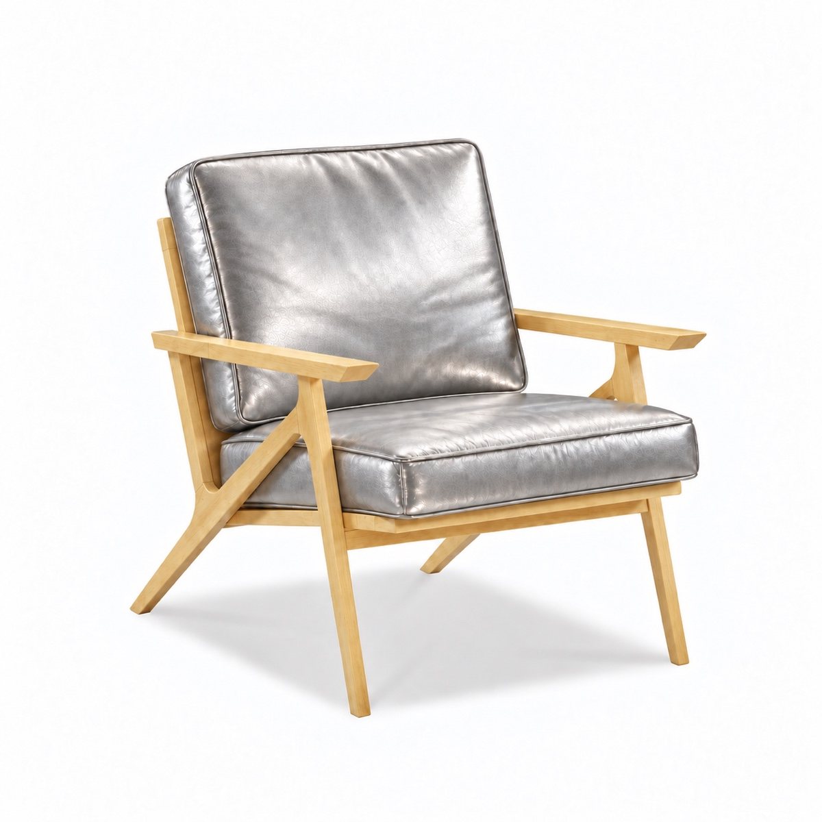 A lounge chair with silver leather cushions on a pale wood frame
